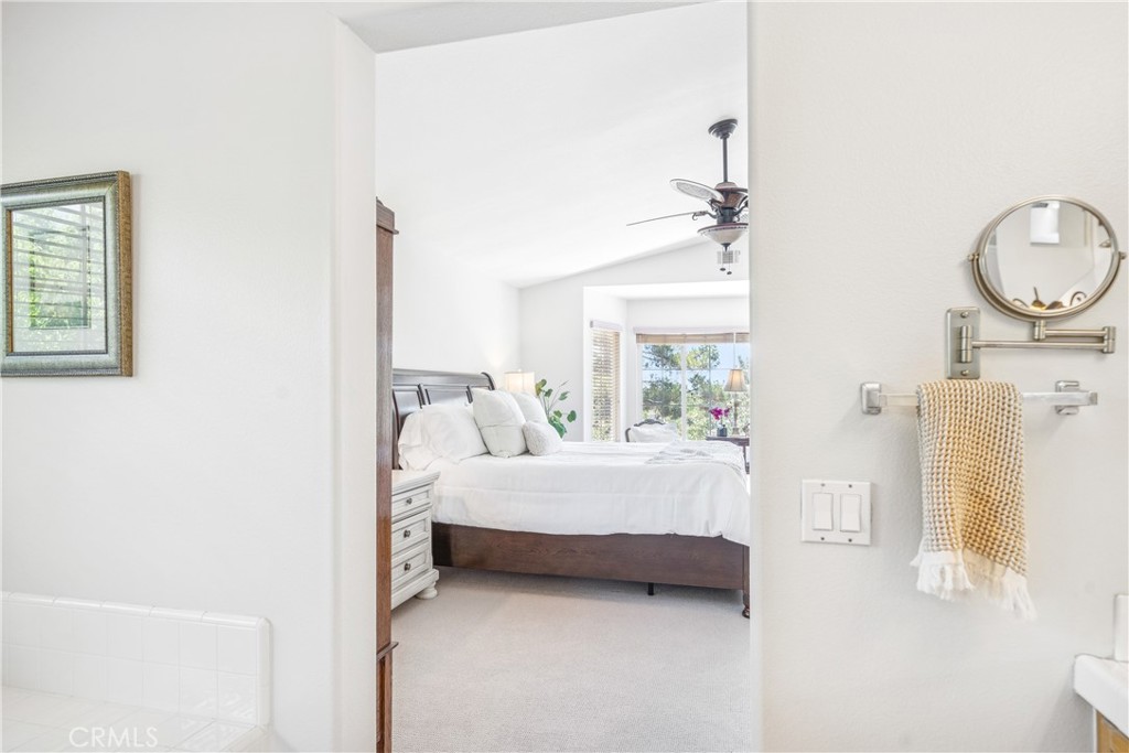 22681 Maplewood Mission Viejo, CA 92692 - Photo 30 of 71 a bedroom with a bed a mirror and a window