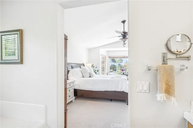 a living room with patio furniture and potted plants