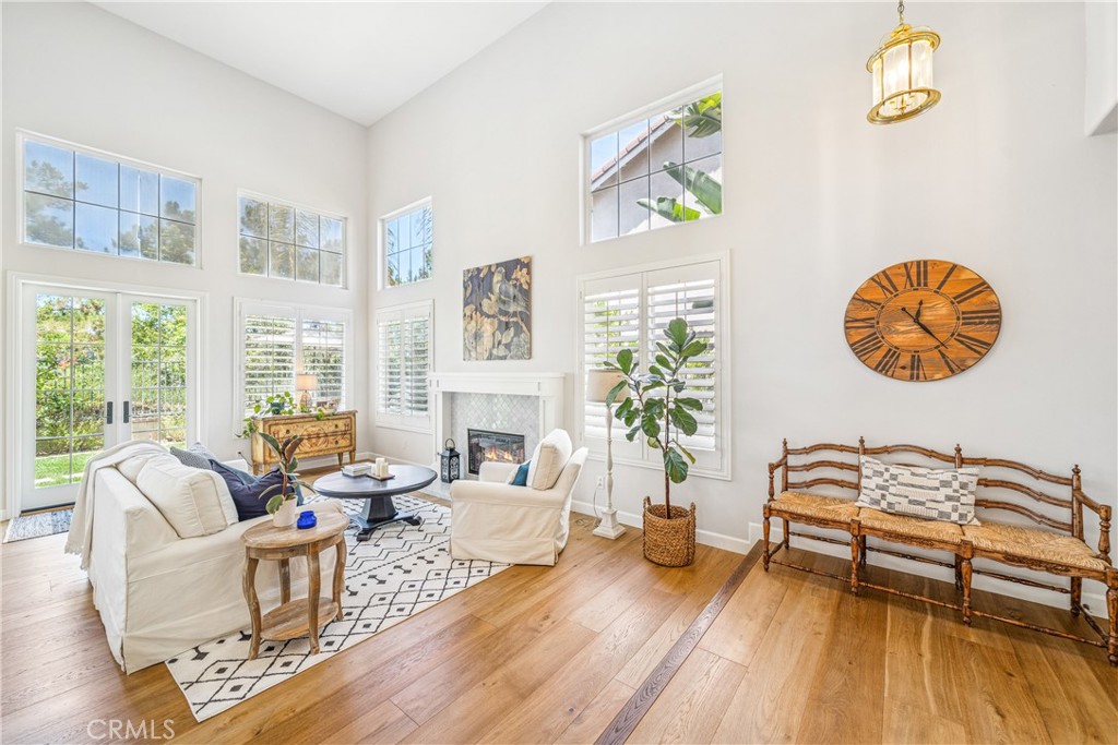 22681 Maplewood Mission Viejo, CA 92692 - Photo 3 of 71 a living room with patio furniture and a wooden floor