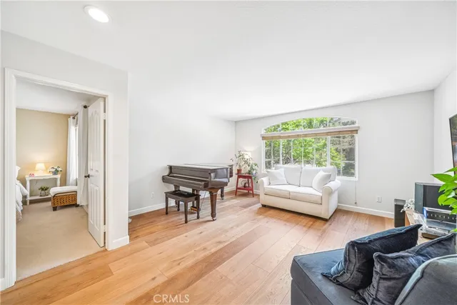 a view of a patio with couches chairs and potted plants