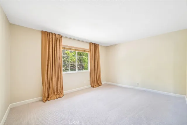 a view of backyard with seating space and trees