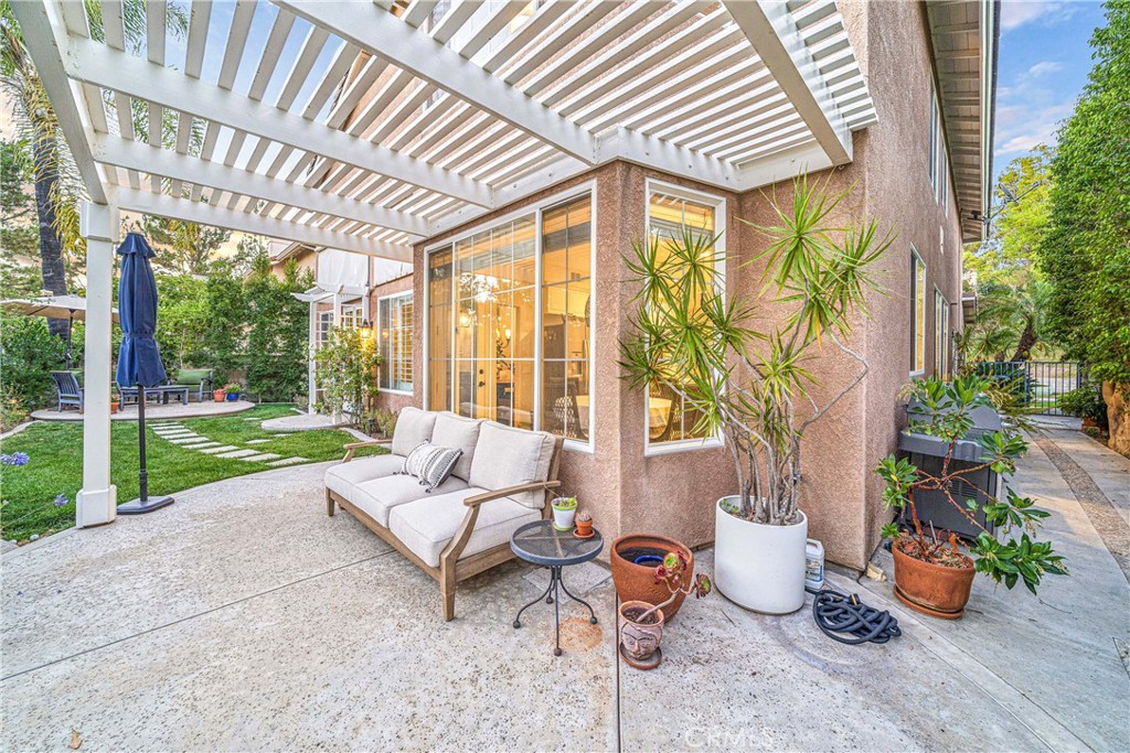 22681 Maplewood Mission Viejo, CA 92692 - Photo 39 of 71 a living room with patio furniture and potted plants