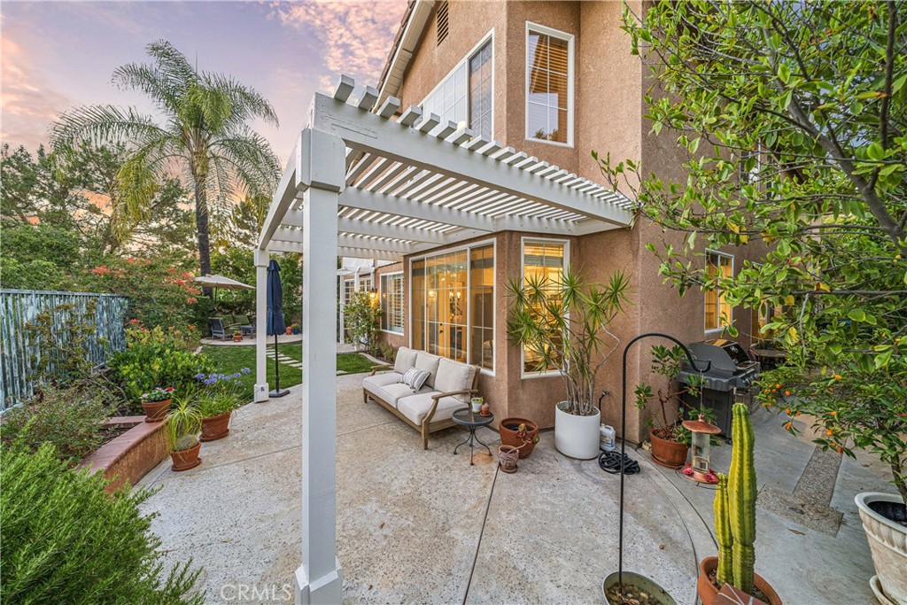 22681 Maplewood Mission Viejo, CA 92692 - Photo 40 of 71 a view of a patio with couches table and chairs and potted plants