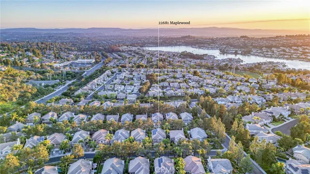 a view of a patio with a table chairs and a yard