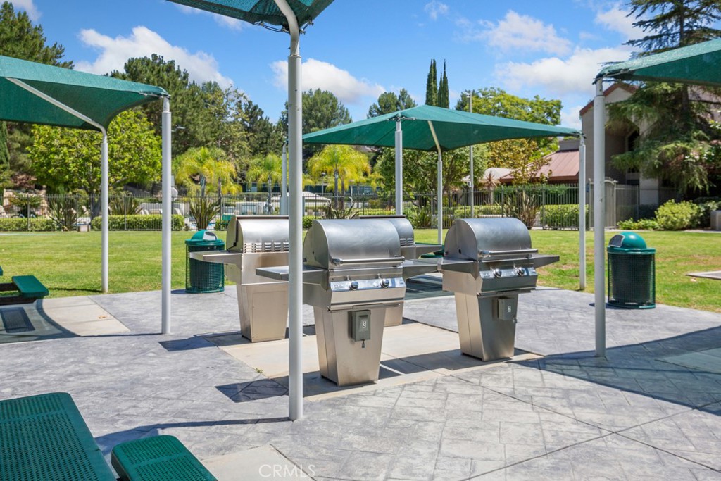 22681 Maplewood Mission Viejo, CA 92692 - Photo 67 of 71 a view of a patio with a table chairs and a yard