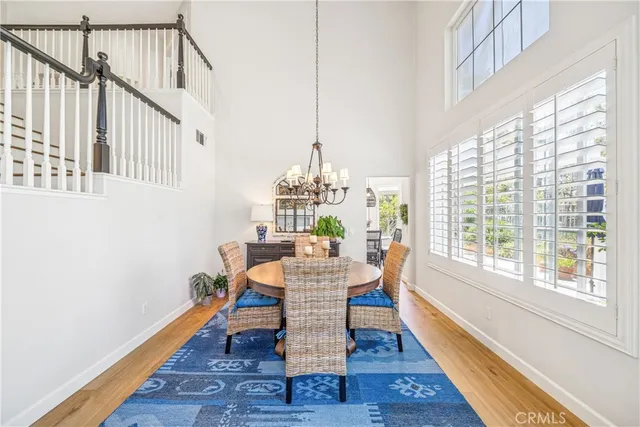 a view of a dining room with furniture and a potted plant