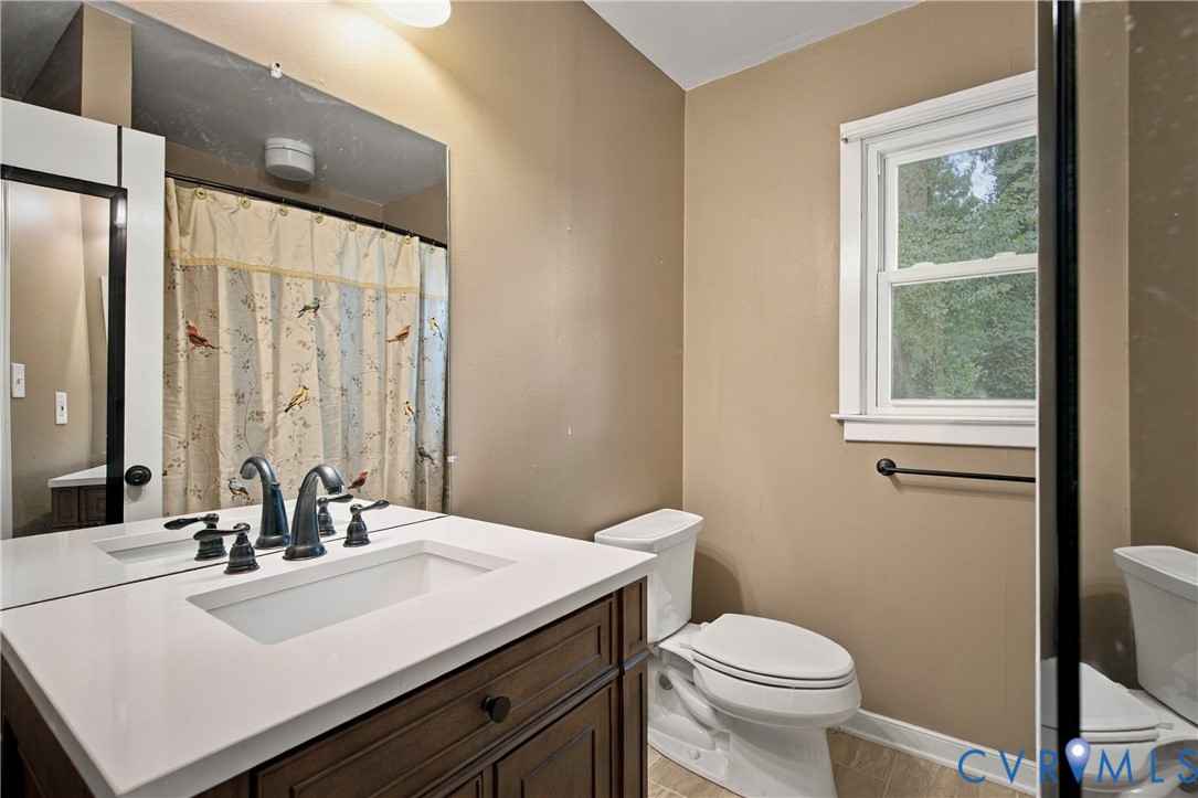 7224 Full Rack Drive Midlothian, VA 23112 - Photo 17 of 36 Bathroom featuring a wood-finish vanity with white