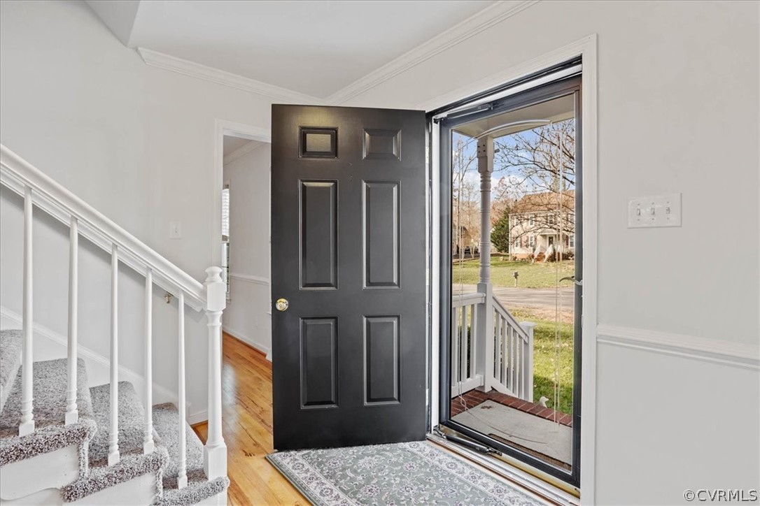 623 Glenmeadow Road Midlothian, VA 23114 - Photo 7 of 49 Front foyer has new lighting, hardwood and glass storm door.