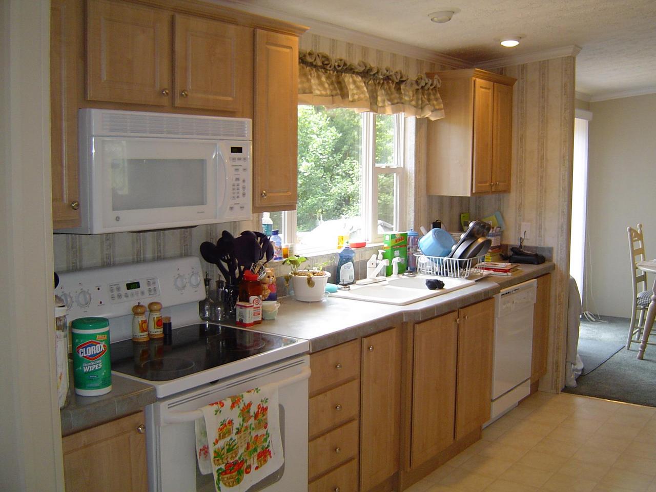 2134 Novelty Road Penhook, VA 24137 - Photo 8 of 9 a kitchen with a sink stove and cabinets