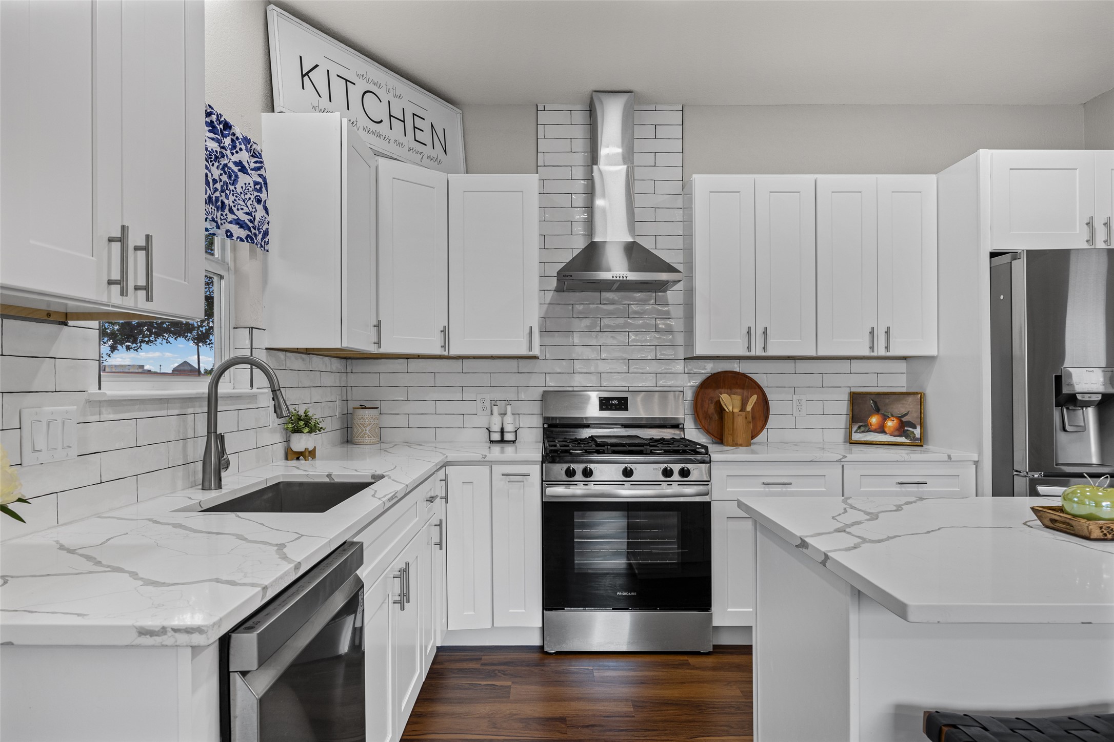 1524 Lochaline Loop Pflugerville, TX 78660 - Photo 9 of 22 Clean lines define this bright kitchen, complete with white shaker cabinets and sleek stainless steel appliances.