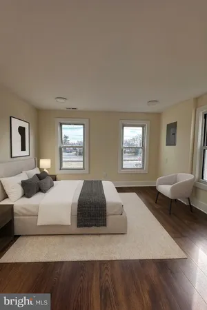 a bedroom with a large bed and a couch