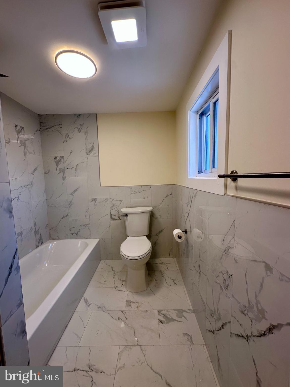 1019 North Broad Street Woodbury, NJ 08096 - Photo 16 of 37 Modern bathroom with elegant marble tiles.