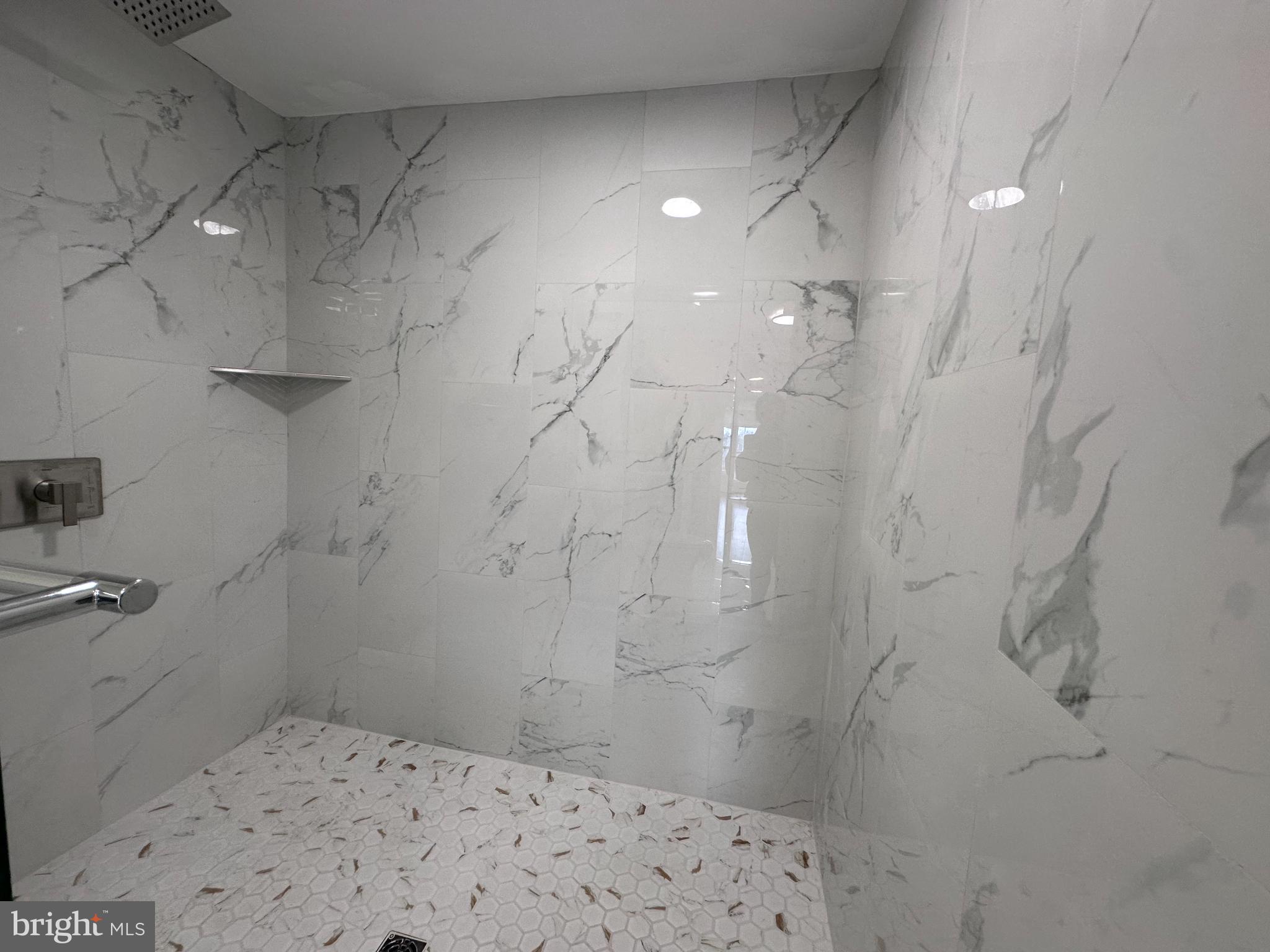 1019 North Broad Street Woodbury, NJ 08096 - Photo 21 of 37 3rd Sleek marble shower in master bedroom.