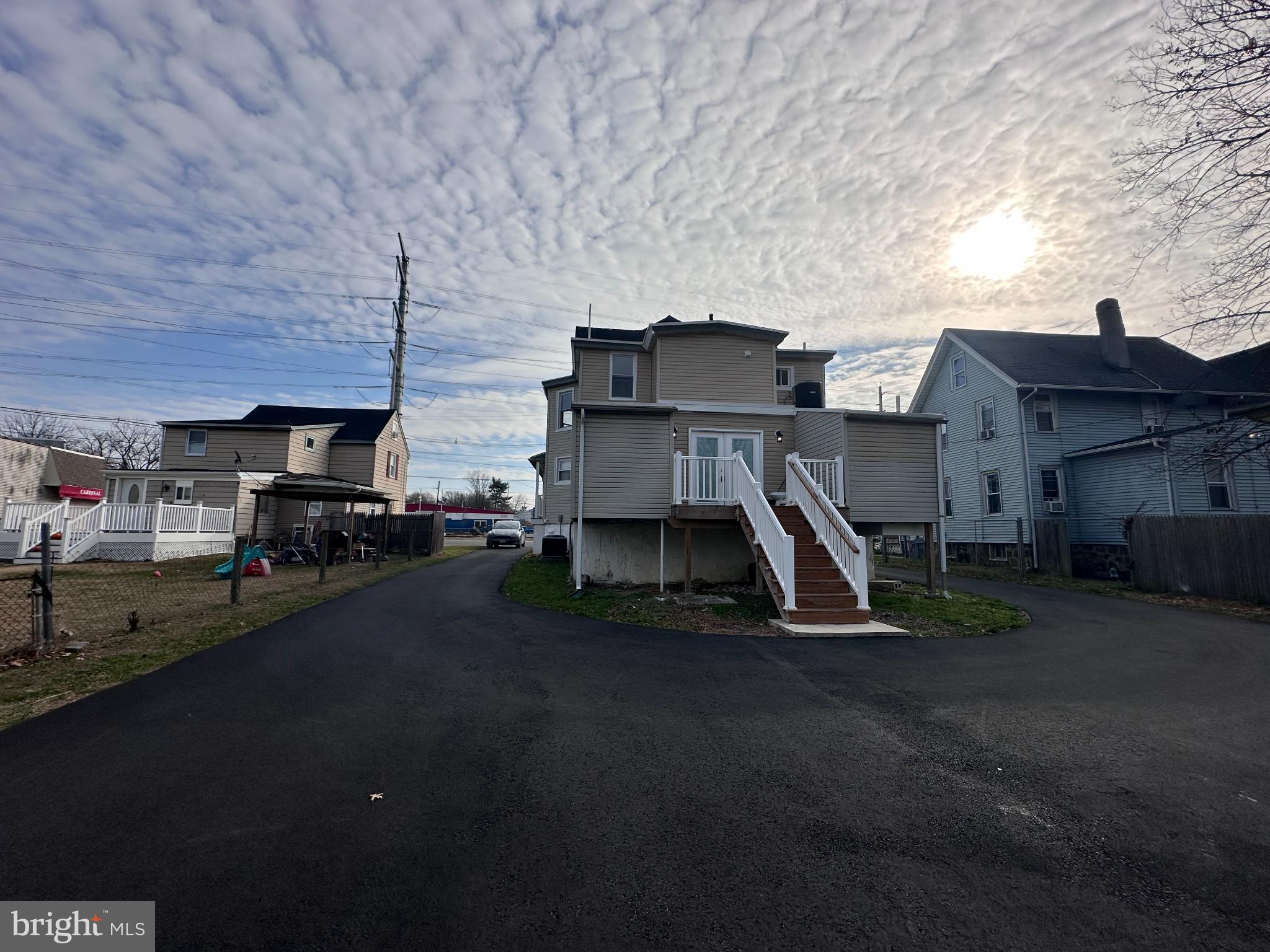 1019 North Broad Street Woodbury, NJ 08096 - Photo 33 of 37 Charming home under a dramatic sky.