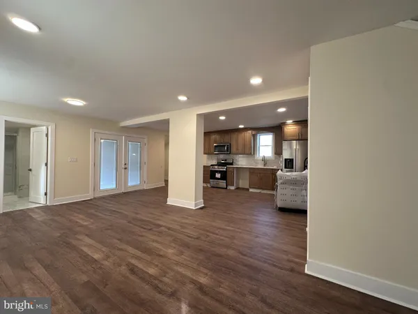 a view of kitchen with furniture and wooden floor