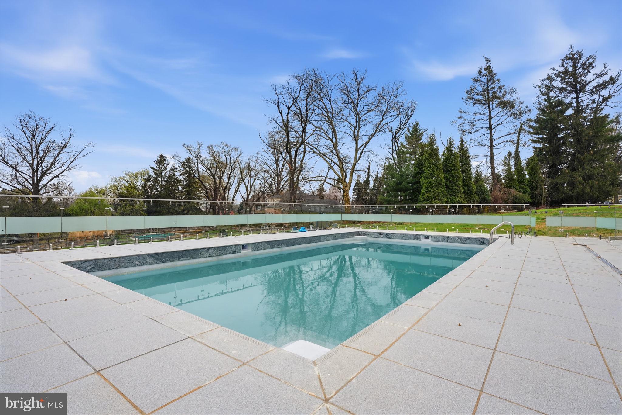 1047 Welsh Road Huntingdon Valley, PA 19006 - Photo 88 of 96 a view of a swimming pool and a yard