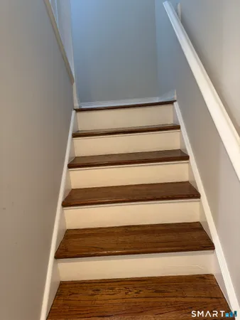 a view of a house next to a yard