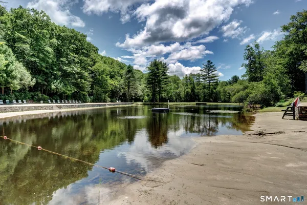 a view of a lake with a house in the background