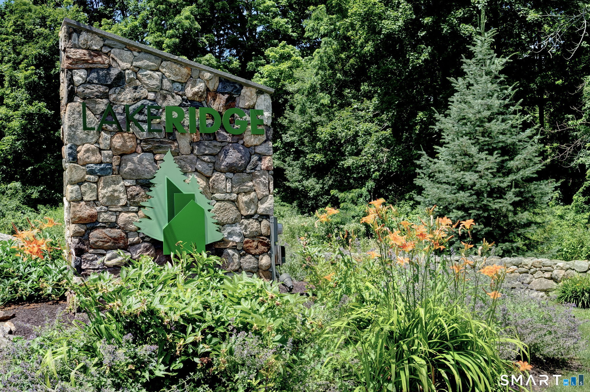 355 Ledge Drive, Unit 355 Torrington, CT 06790 - Photo 2 of 58 a green field covered with trees