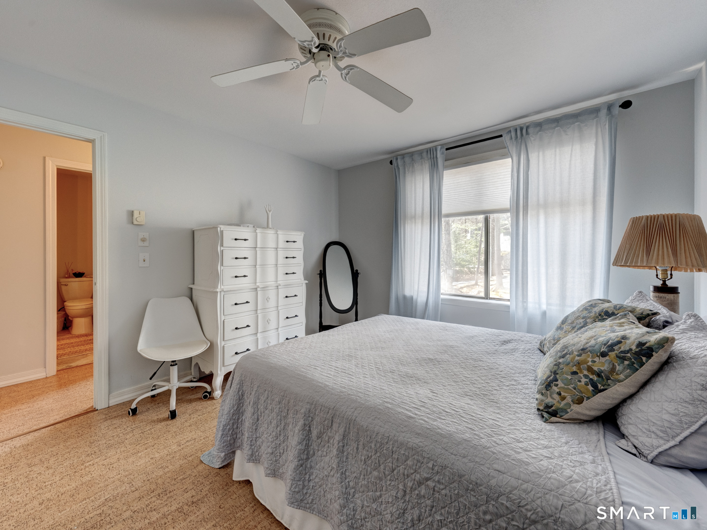 355 Ledge Drive, Unit 355 Torrington, CT 06790 - Photo 36 of 58 a bedroom with a bed large window and couch