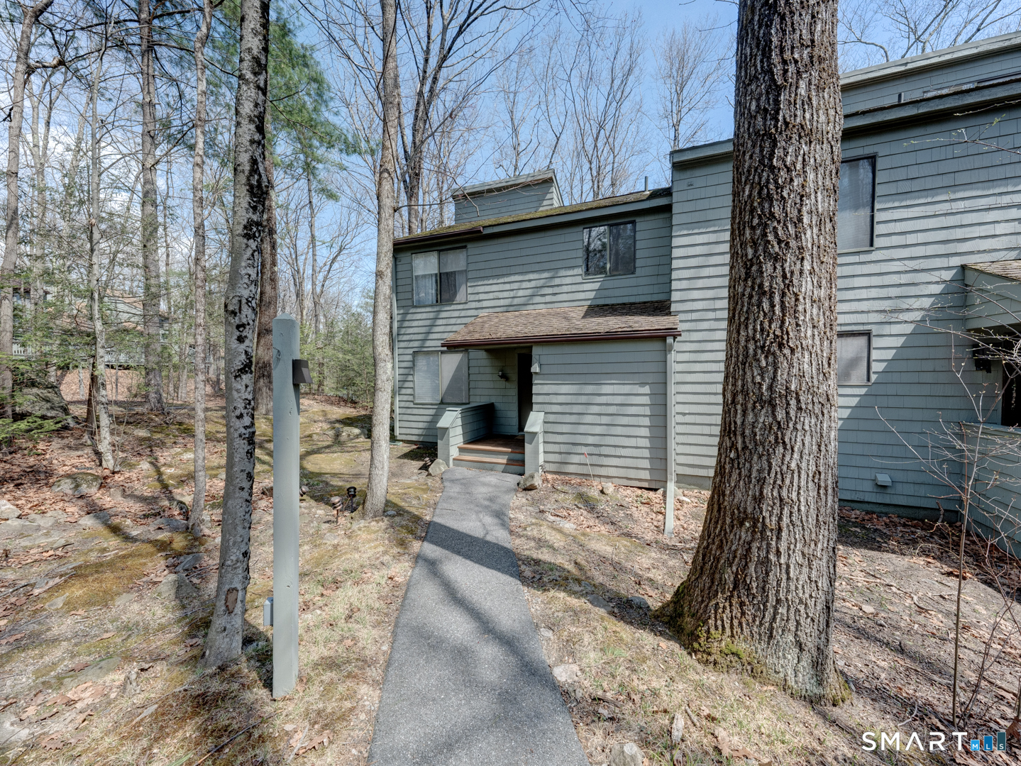 355 Ledge Drive, Unit 355 Torrington, CT 06790 - Photo 40 of 58 a front view of a house with a yard