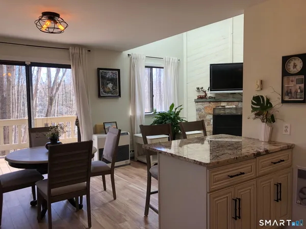 a dining room with a table and chairs