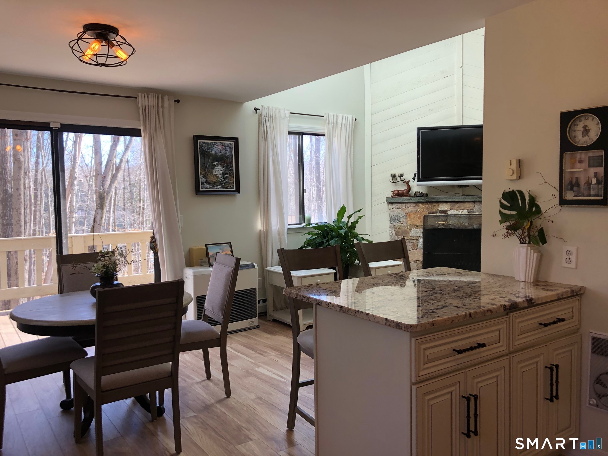 355 Ledge Drive, Unit 355 Torrington, CT 06790 - Photo 4 of 34 a dining room with a table and chairs