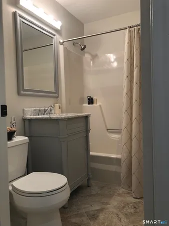 a view of a bedroom with cabinets