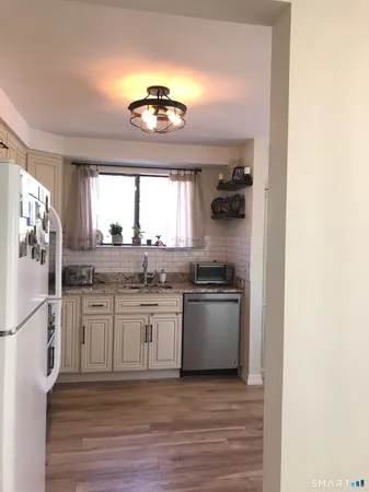 a view of a bedroom with cabinets