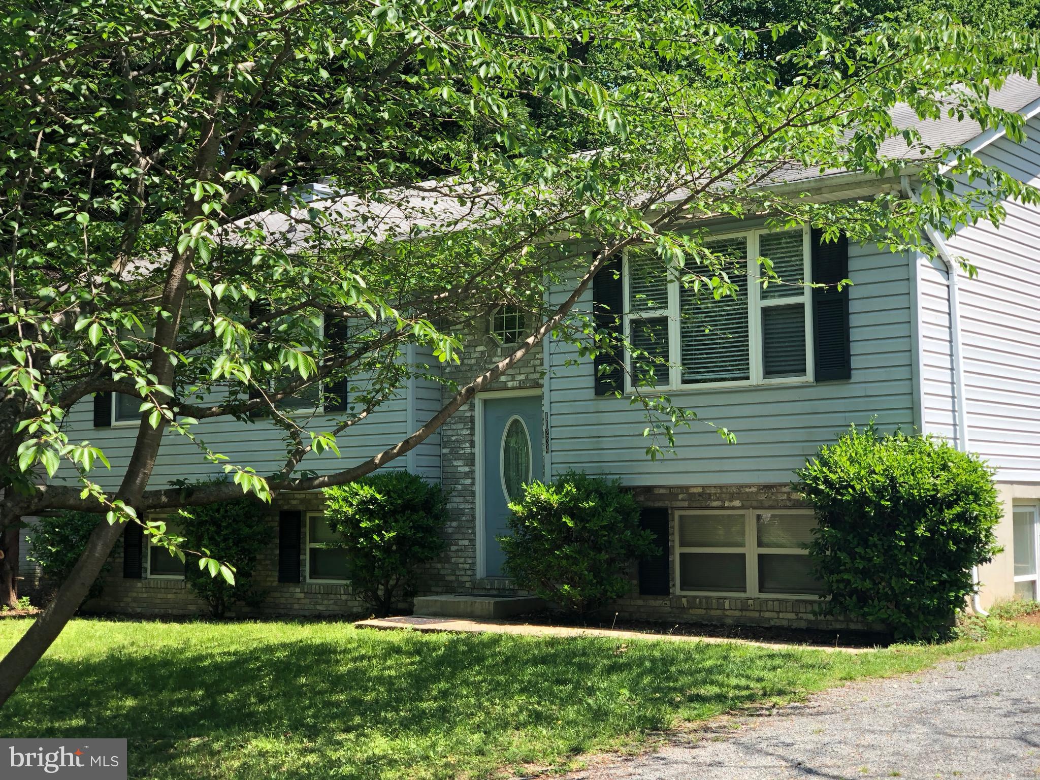 11234 Commanche Road Lusby, MD 20657 - Photo 2 of 21 a view of house with a yard