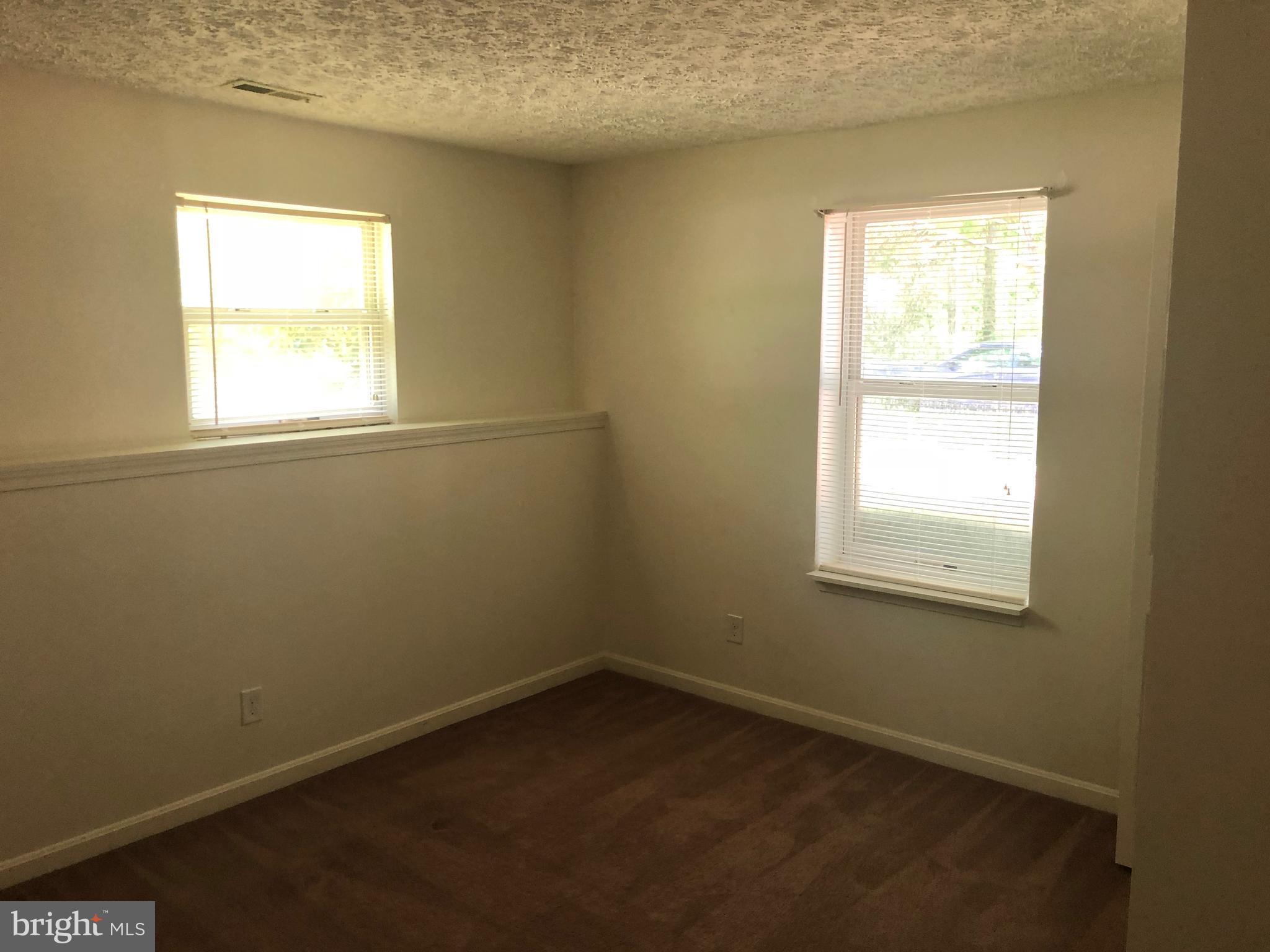 11234 Commanche Road Lusby, MD 20657 - Photo 17 of 21 an empty room with a window