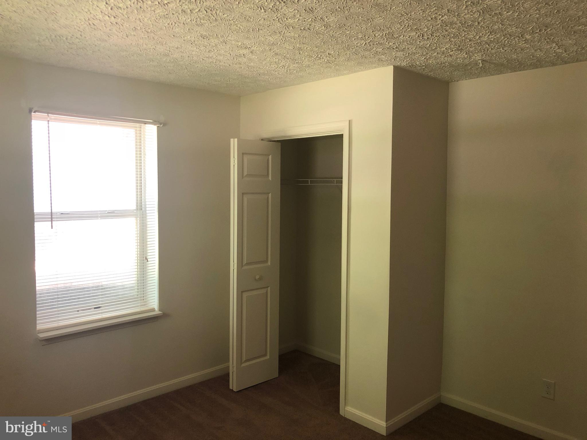 11234 Commanche Road Lusby, MD 20657 - Photo 18 of 21 a view of an empty room with closet and a window