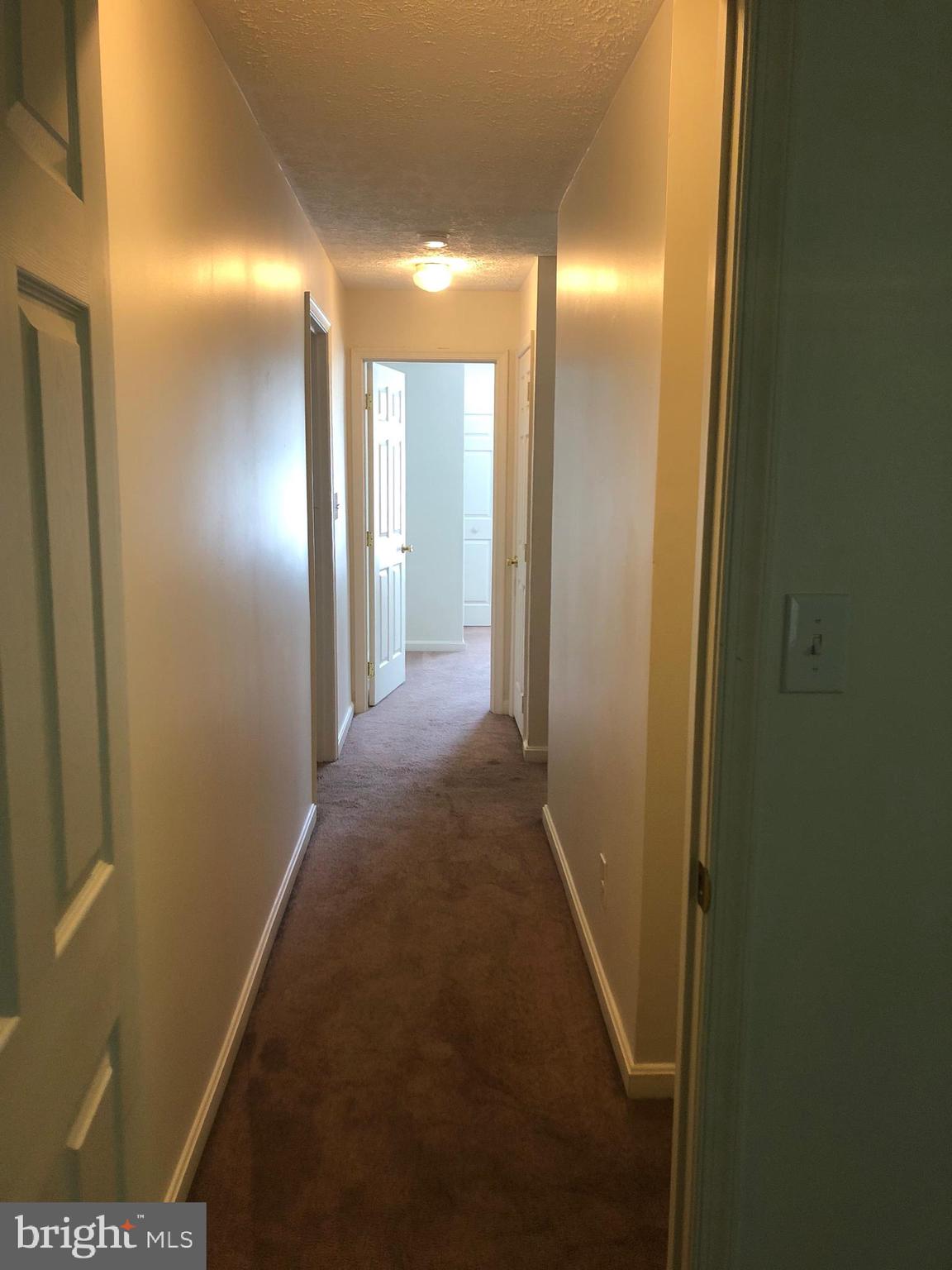 11234 Commanche Road Lusby, MD 20657 - Photo 19 of 21 a view of hallway with a bathroom