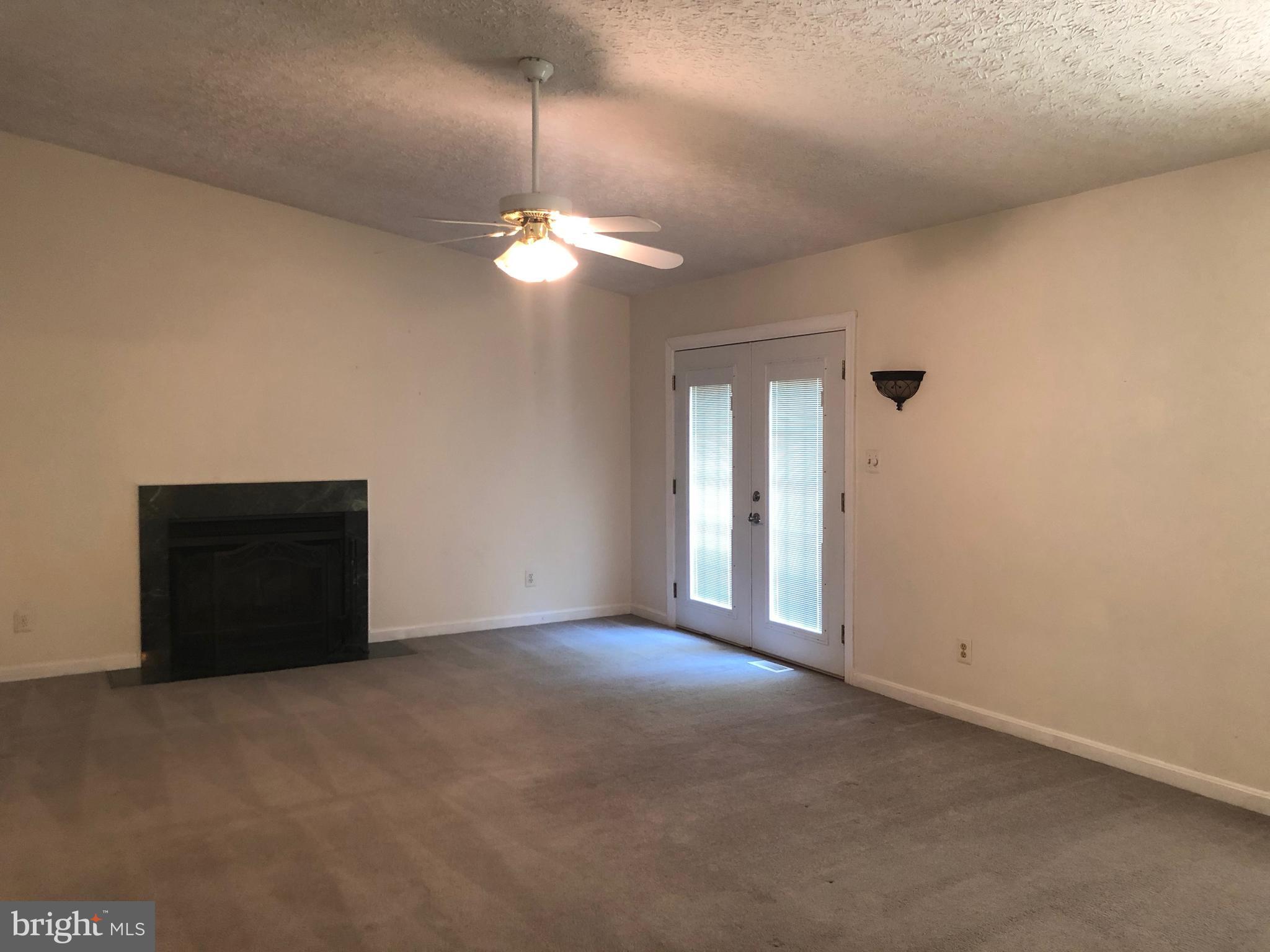 11234 Commanche Road Lusby, MD 20657 - Photo 6 of 21 a view of an empty room with a window