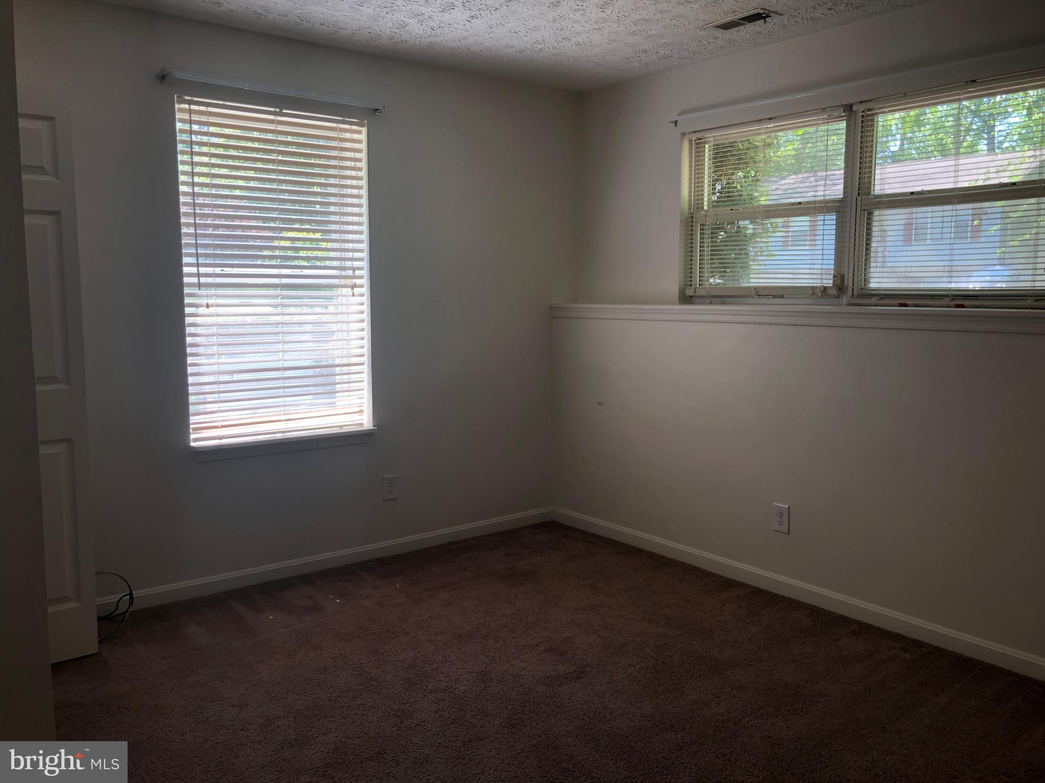 11234 Commanche Road Lusby, MD 20657 - Photo 10 of 21 an empty room with a window