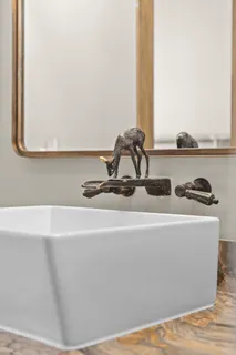 a view of a sink with a desk and chair