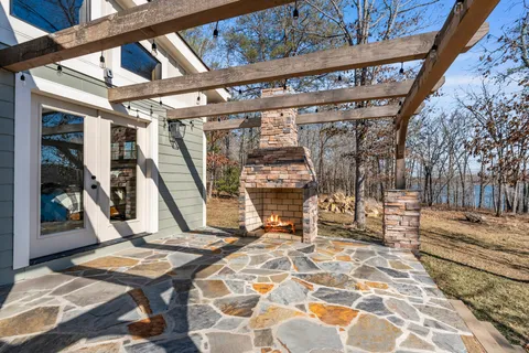 a view of a patio with a table and chairs