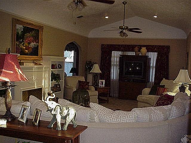 3605 South Hayden Street Amarillo, TX 79110 - Photo 2 of 4 a living room with furniture and a fireplace