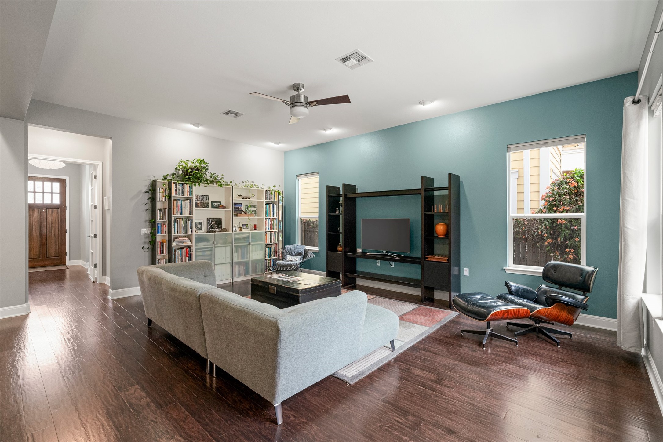 4512 Ruiz Street Austin, TX 78723 - Photo 14 of 38 a living room with furniture and a flat screen tv