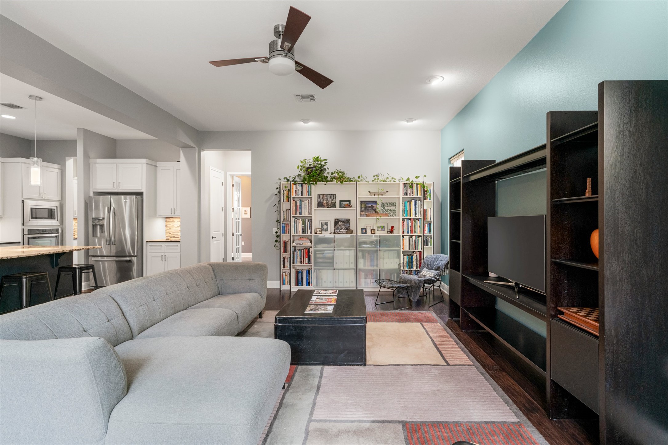 4512 Ruiz Street Austin, TX 78723 - Photo 15 of 38 a living room with furniture and a flat screen tv