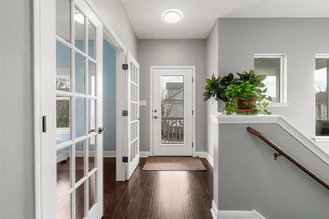 a view of a balcony with chairs