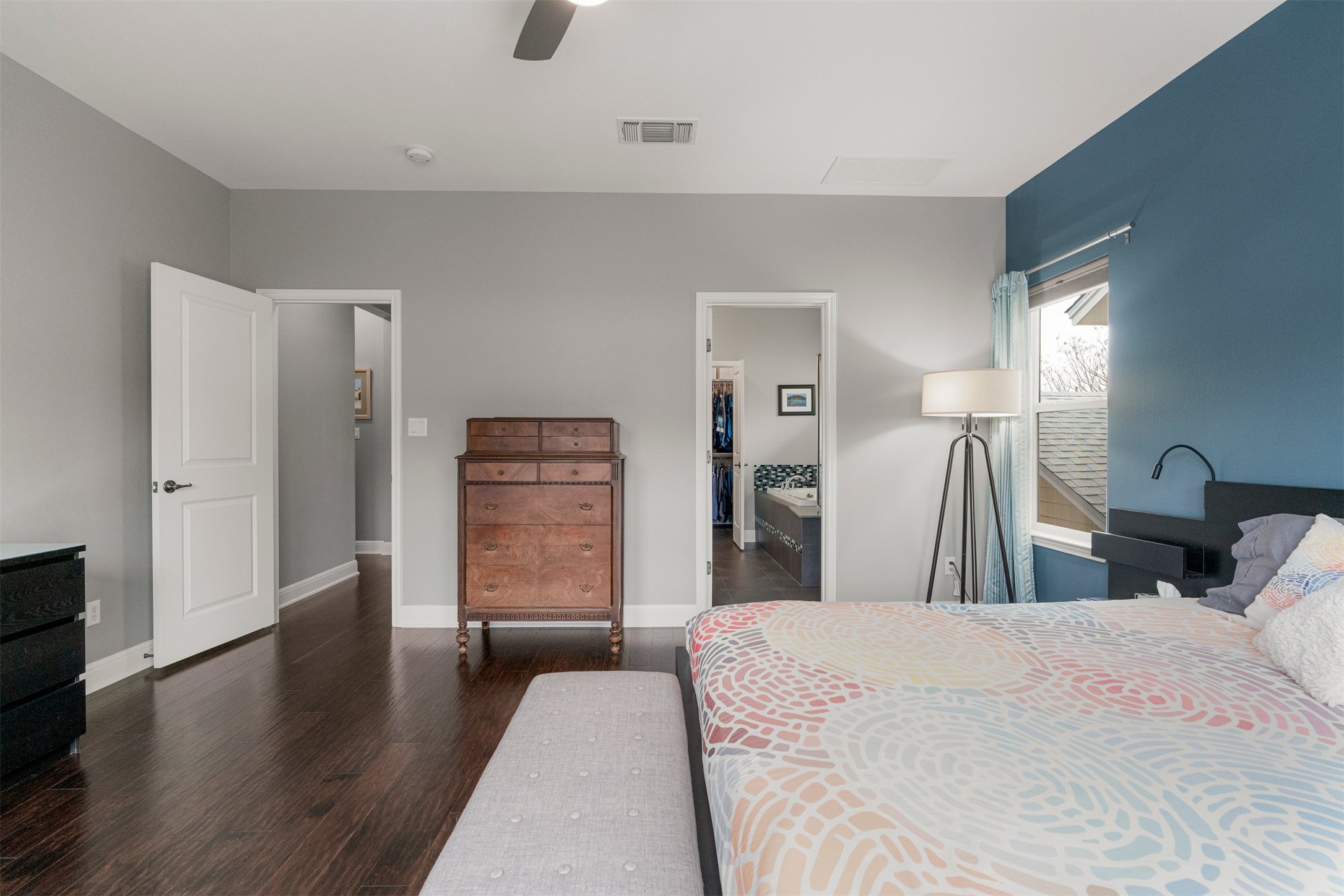 4512 Ruiz Street Austin, TX 78723 - Photo 25 of 40 Positioned alongside the other upstairs bedrooms, the primary suite includes direct access to its own ensuite bathroom, creating a private space within the second floor layout