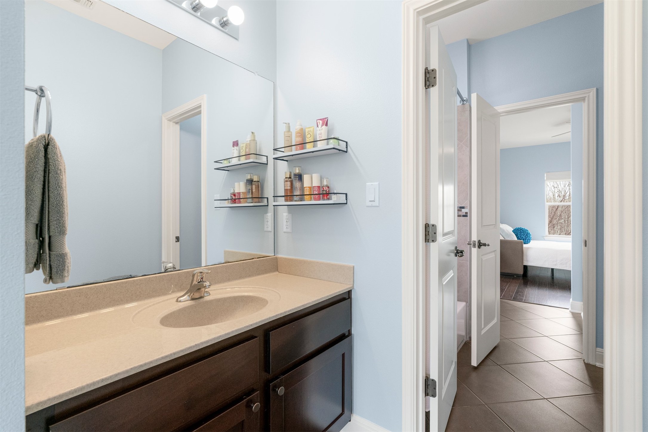 4512 Ruiz Street Austin, TX 78723 - Photo 31 of 40 Each bedroom has its own vanity while they share the shower, tub and toilet