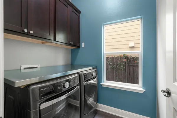 a view of kitchen with furniture and a refrigerator