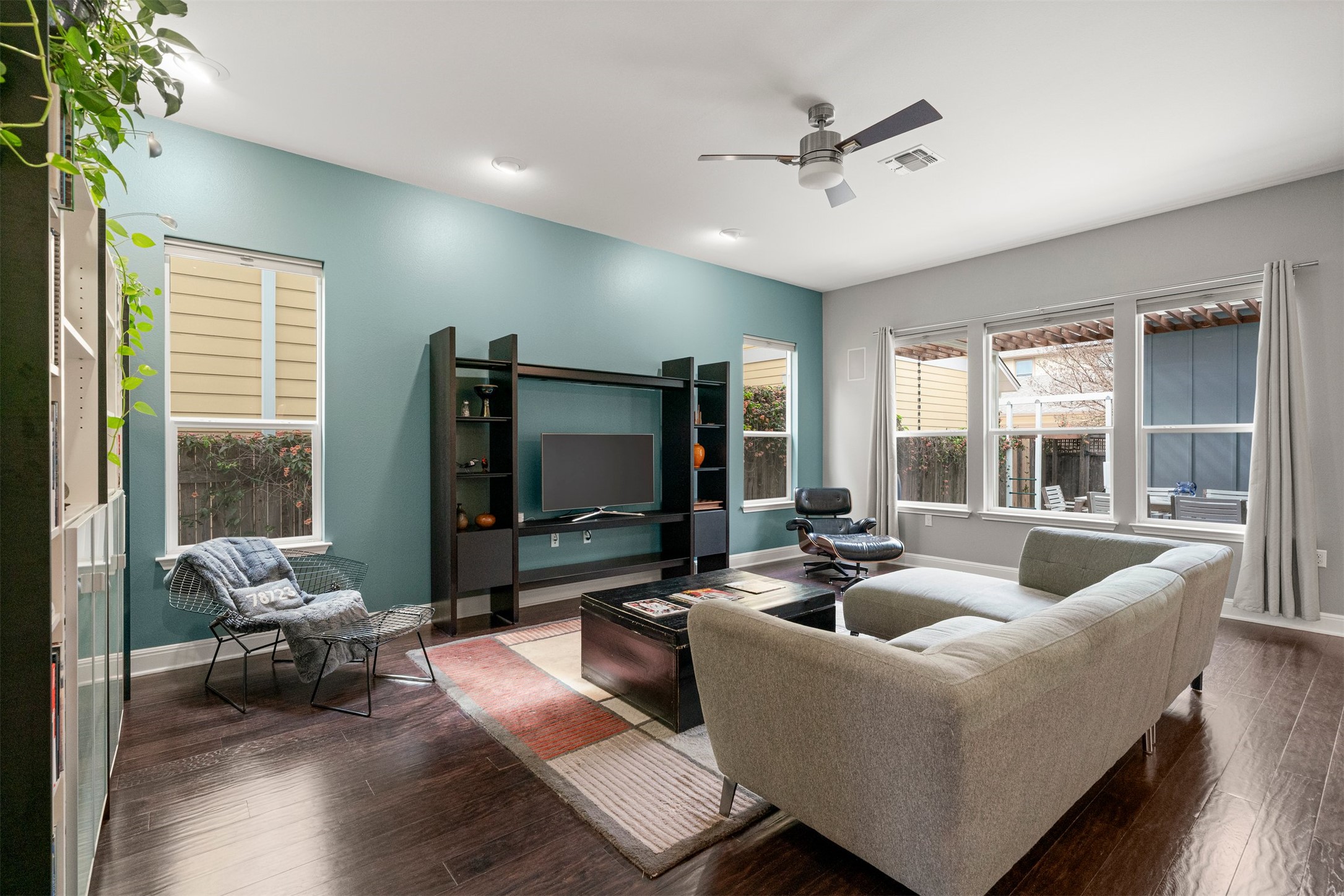 4512 Ruiz Street Austin, TX 78723 - Photo 4 of 38 a living room with furniture and a flat screen tv