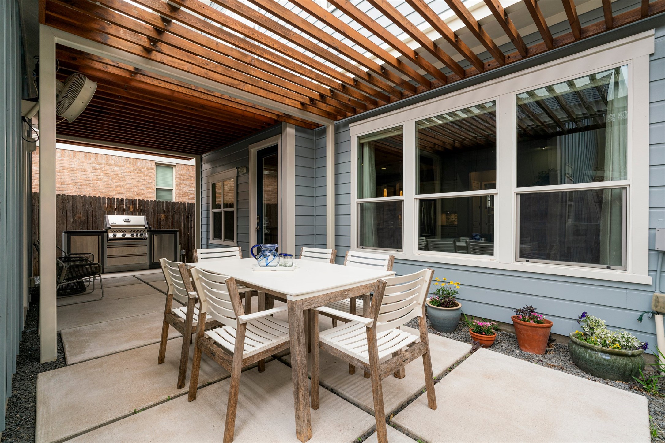 4512 Ruiz Street Austin, TX 78723 - Photo 7 of 38 a view of a patio with table and chairs and potted plants