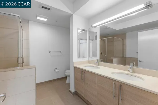 a bathroom with a double vanity sink mirror and double