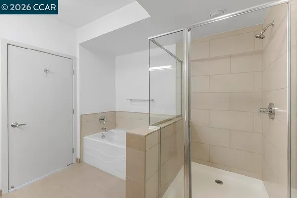 a bathroom with a shower and a sink