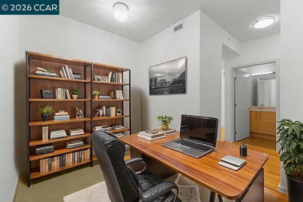a view of a workspace with furniture