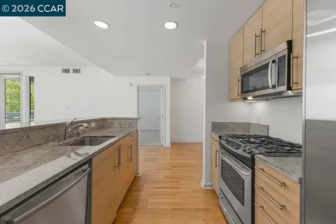 a kitchen that has a sink and a stove